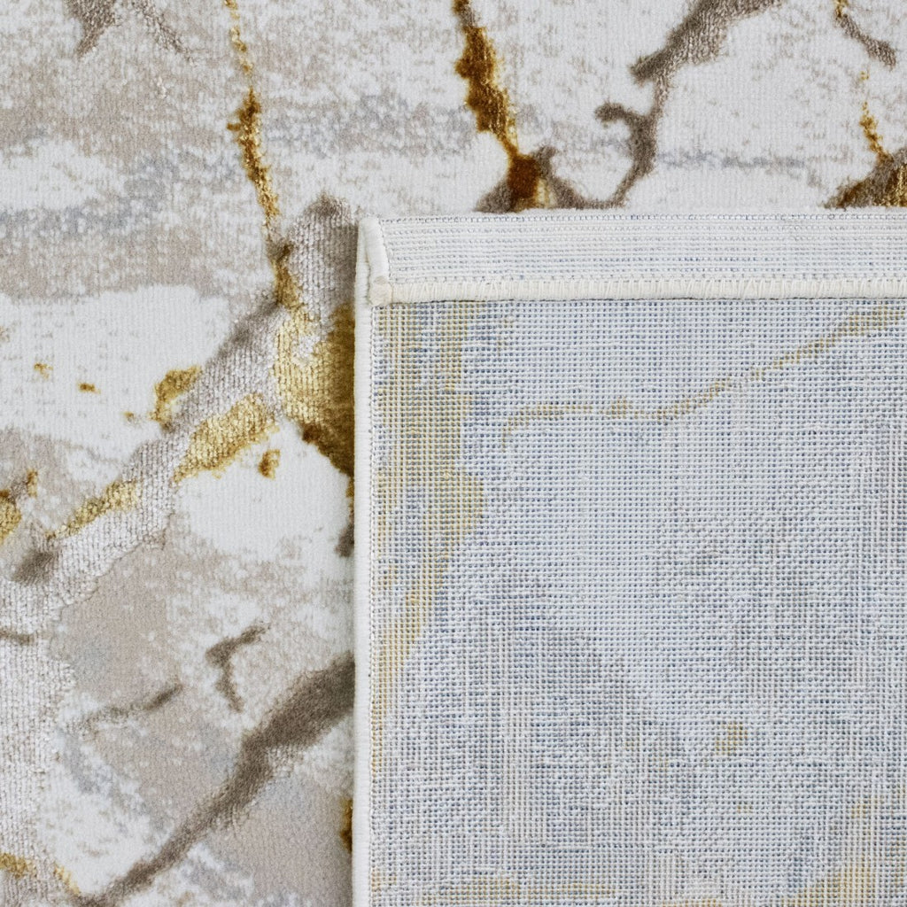 Paradise Living – Tapete Marne 29/009 Amarelo, detalhe do canto com verso resistente ao desgaste e costura de rebordo branca, padrão mármore dourado e bege visível