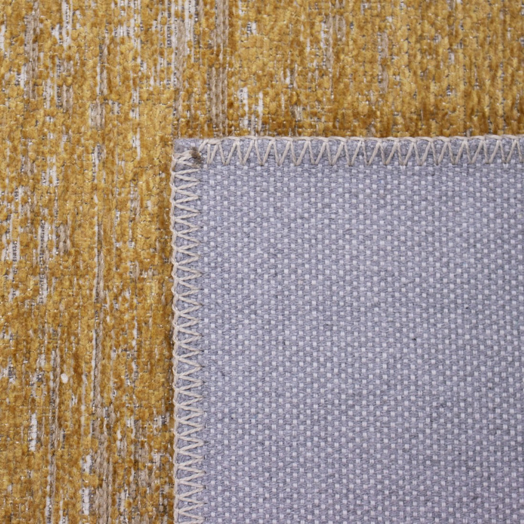 Paradise Living – Tapete Abstrato Adore 4002/850 Laranja, detalhe do verso com base em feltro cinza e acabamento costurado