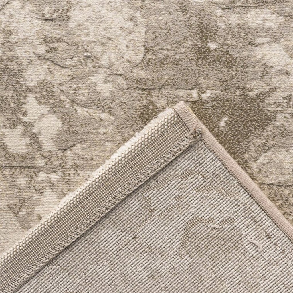 Paradise Living – Tapete Giacomo 63872/6575 detalhe do canto dobrado mostrando frente com padrão desgastado e verso em cinzento bege
