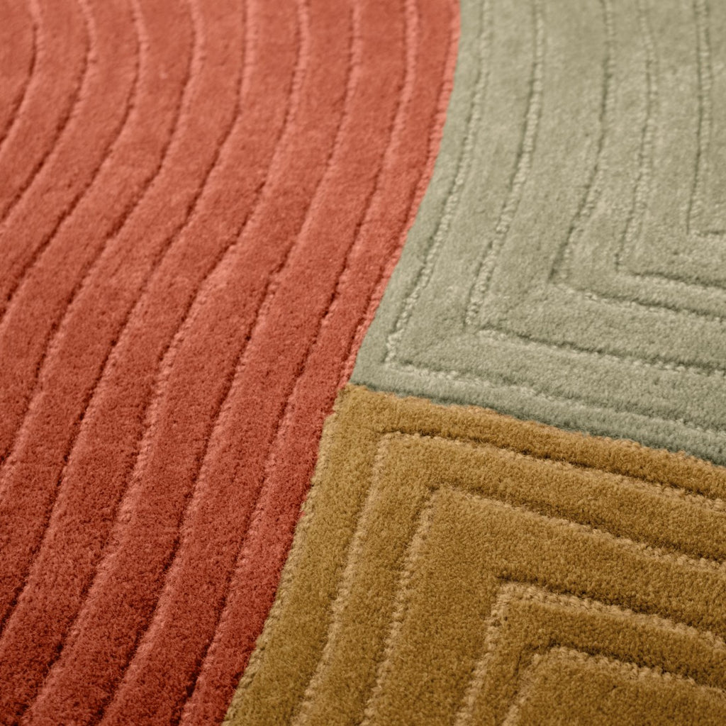 Paradise Living Tapete Pebble – Detalhe das texturas em relevo e paleta de cores terracota, mostarda e verde
