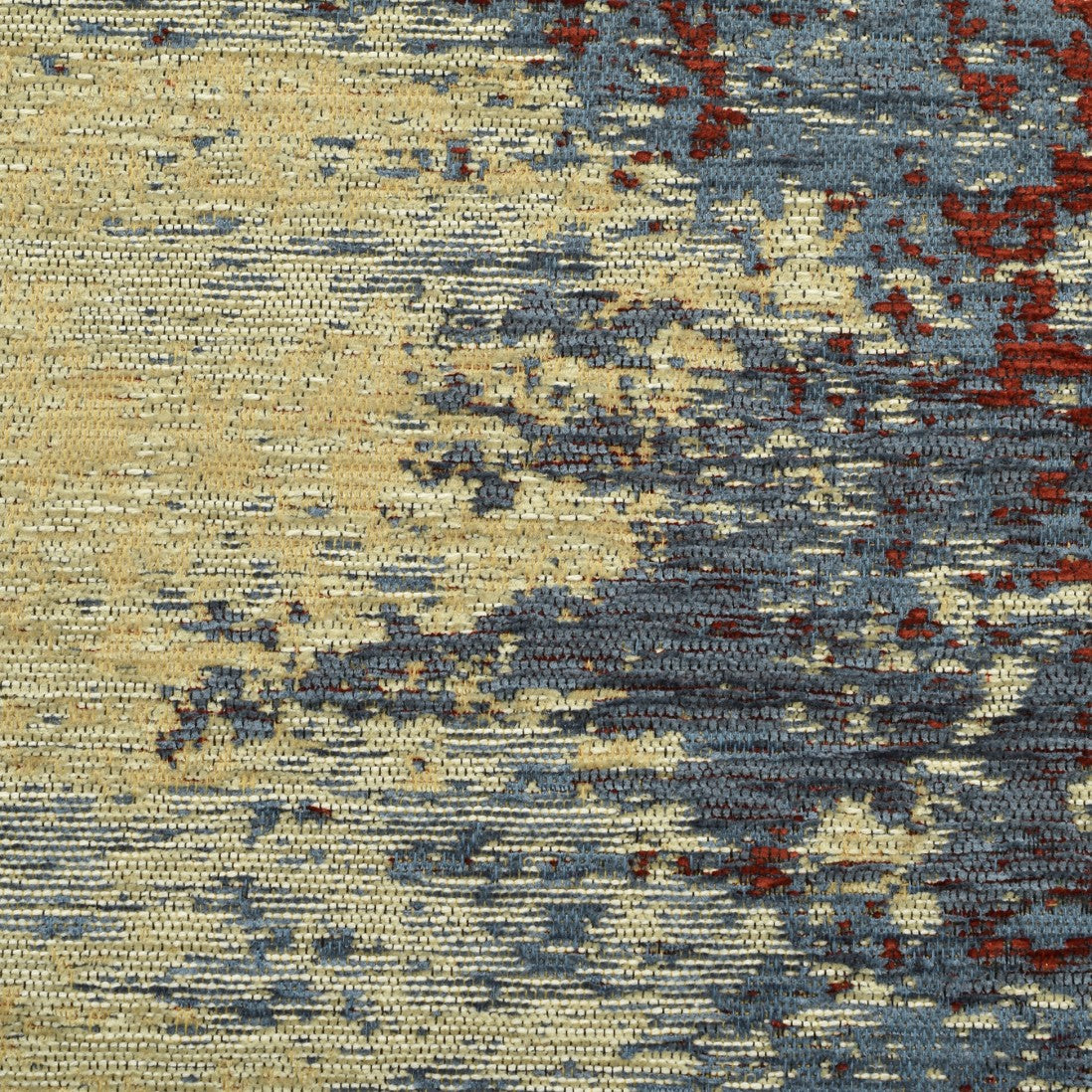 Paradise Living – Tapete Ametist Chenille 070 Multicolor close-up da textura chenille com padrão abstrato em tons azul acinzentado, vermelho e bege