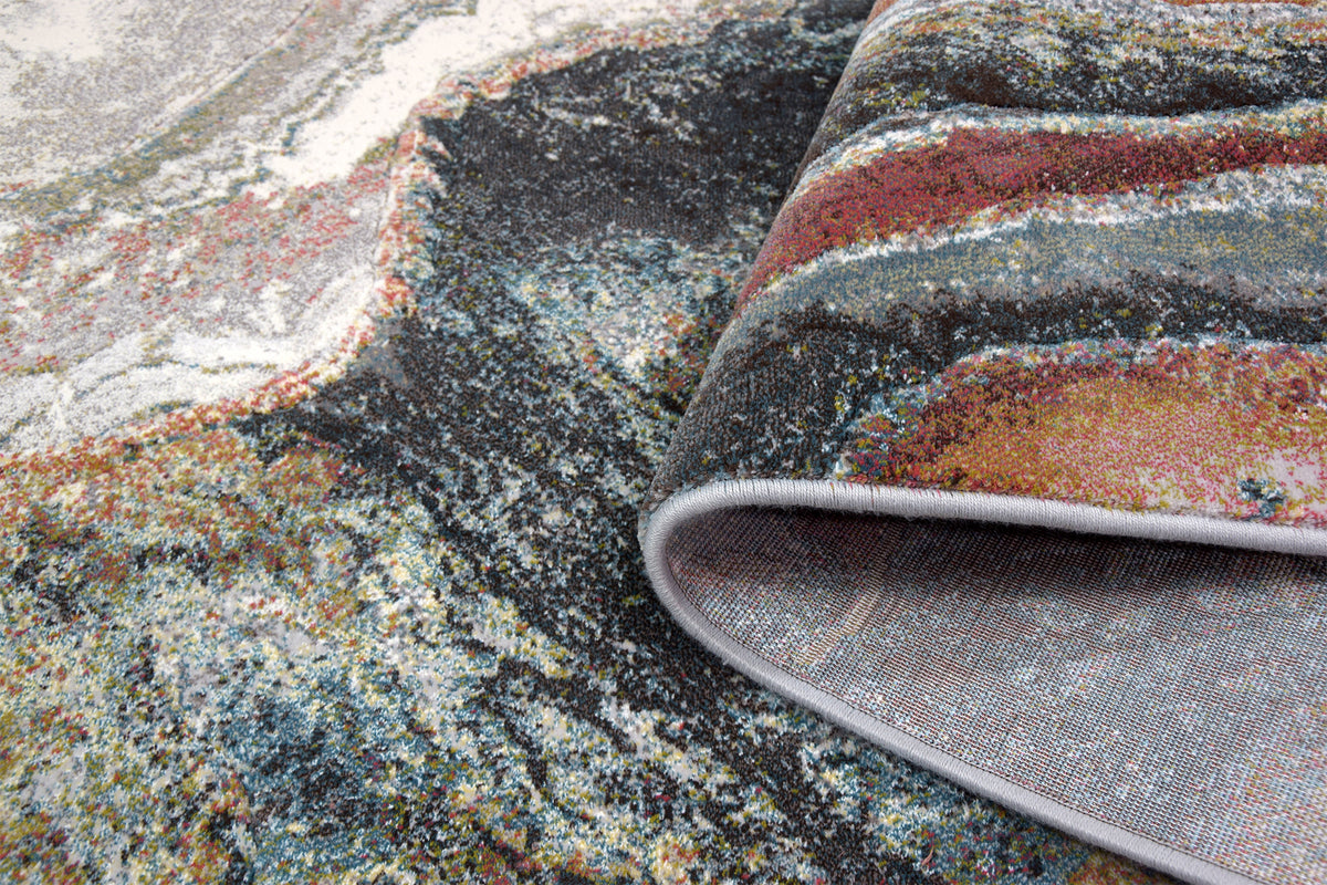 Detalhe do padrão abstrato de inspiração mineral do tapete Monetti 63618/7270